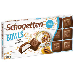 Продуктови Категории Шоколади Schogetten млечен шоколад с пълнеж от крема сирене с вкус Skyr, овесена хрупкавост, парченца лешник и мед 100 гр